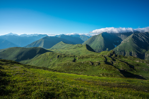 Stunning summer landscape of green Caucasus mountains at sunny day