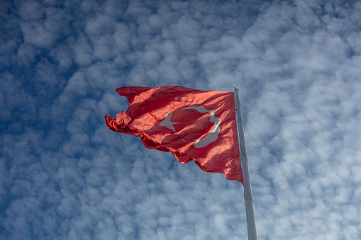 Red flags flying under the blue sky