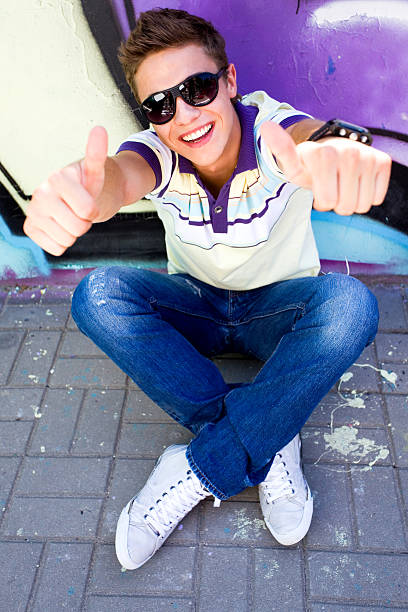 istock Young man with thumbs up 146925551