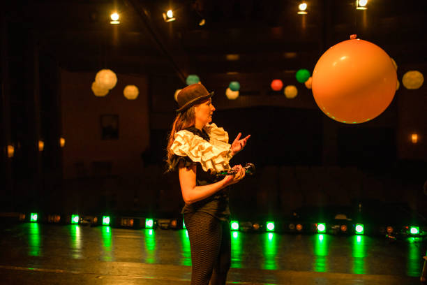 Young female actor on stage during the performance