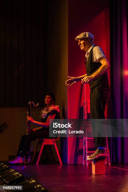 Small Group Of Actors On Stage During The Performance Stock Photo - Download Image Now