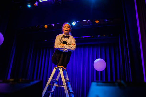 istock Young female actor on stage during the performance 1469258067