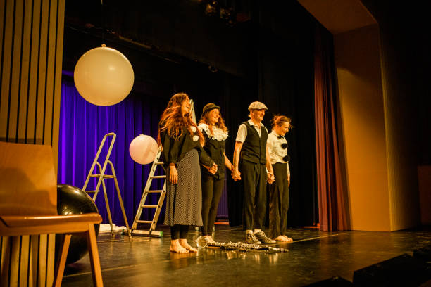 istock Four actors on stage taking the applause 1469258294