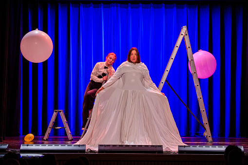 Two actors performing on stage