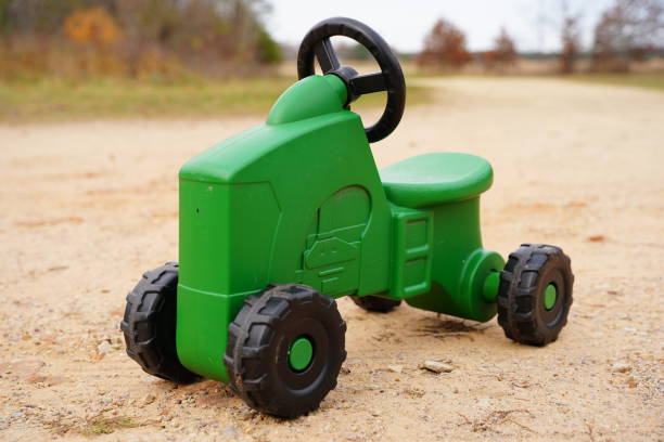 An antique toy tractor with pull string isolated on white