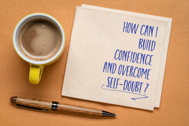 istock How can I build confidence and overcome self-doubt? Inspirational question on a napkin. 1469266345