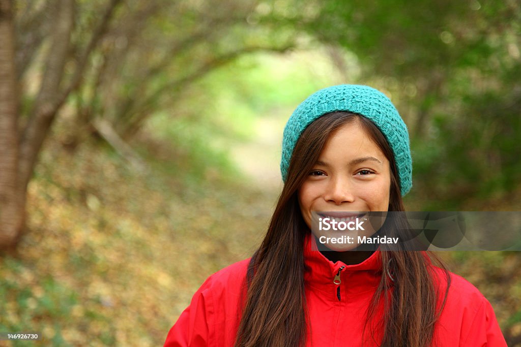 Autumn girl portrait Autumn woman smiling. Beautiful woman walking in the forest on a fall day. Click for more: 18-19 Years Stock Photo