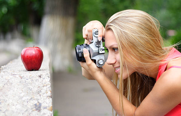 photographer and apple stock photo