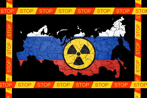 Russian flag map with nuclear weapon sign. Russian military aggression