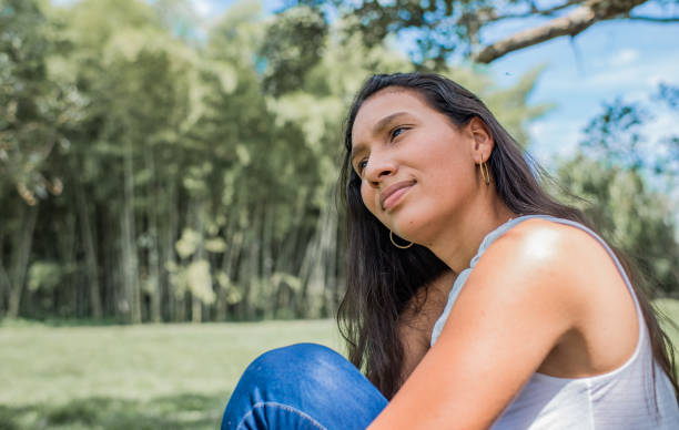 istock Young woman outdoors at the river bank. 1469297438