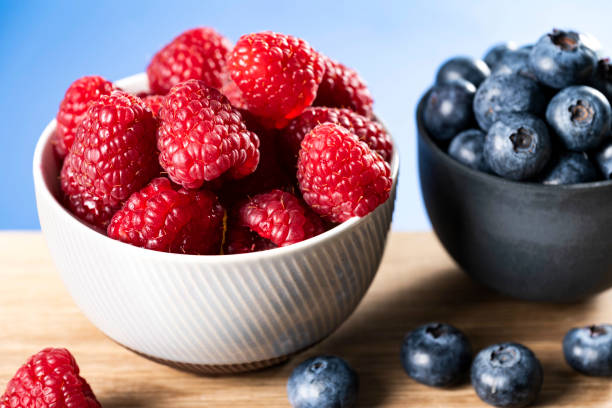 istock Raspberries and Blueberries summer fruit stock photo 1469297619