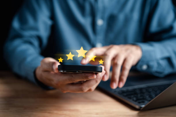 istock Businessman showing five star on hands, Customer satisfaction feedback review concept. Customer online service experience and business satisfaction. 1469297772
