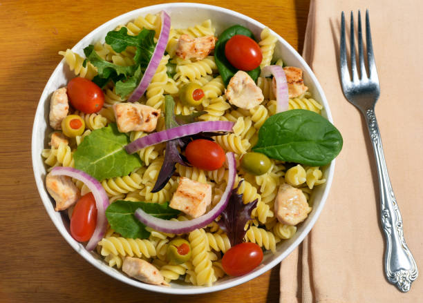 istock rotini  and chicken salad  with mixed green, 1469299898