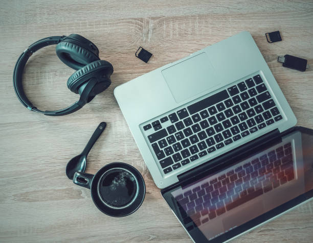 istock Laptop, coffee cup, headphones and sd cards 1469299939