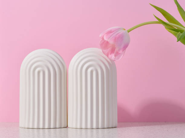 istock White ceramic decorative arch on a pink background, background for showcasing cosmetics, products, advertising and promotion. 1469302632