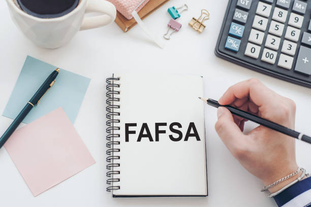 istock FAFSA inscription on the documents. Business concept 1469314695