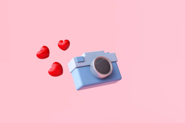 istock Blue camera with heart on pink background. Summer travel concept 1469320394