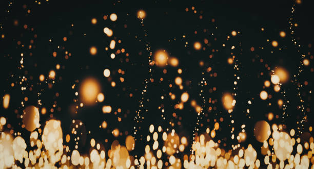 istock Golden particles on dark background, flying glittering shiny sparkles on black banner, event party holiday Christmas design 1469326167