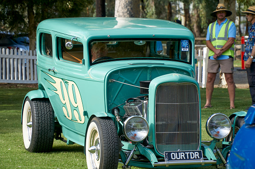 A green Hot rod as it is arriving at Tongala Show and Shine Victoria Australia with 99 on the sides