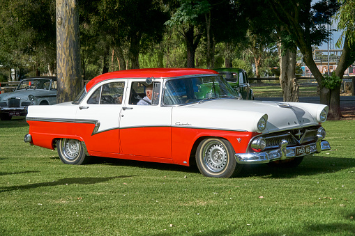 One of two Red and White classic car as it arrives at Tongala Show and Shine Victoria Australia