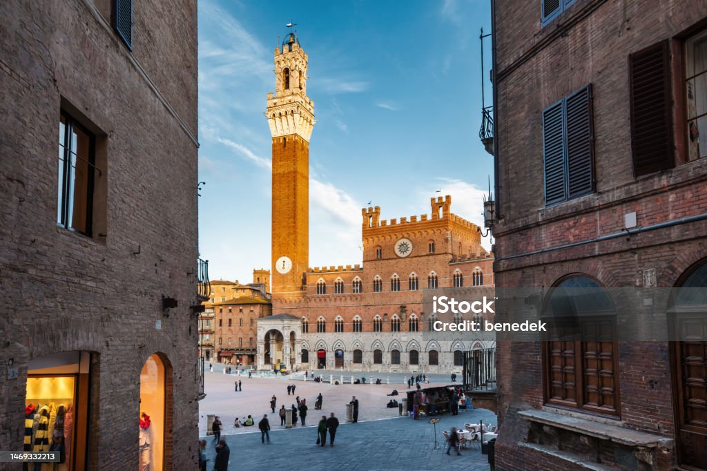 Downtown Siena Italy Old Town Piazza del Campo with the historic Palazzo Pubblico and Torre del Mangia in downtown Siena, Tuscany, Italy. Siena - Italy Stock Photo
