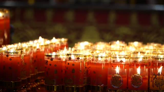candlelight in chinese shrine in thailand