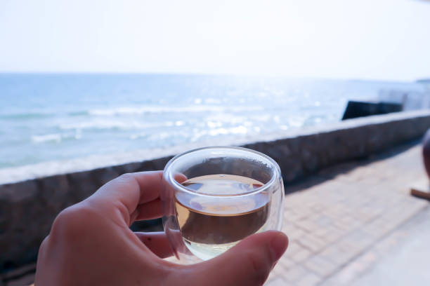 istock hot tea or drinking tea near the sea 1469349611