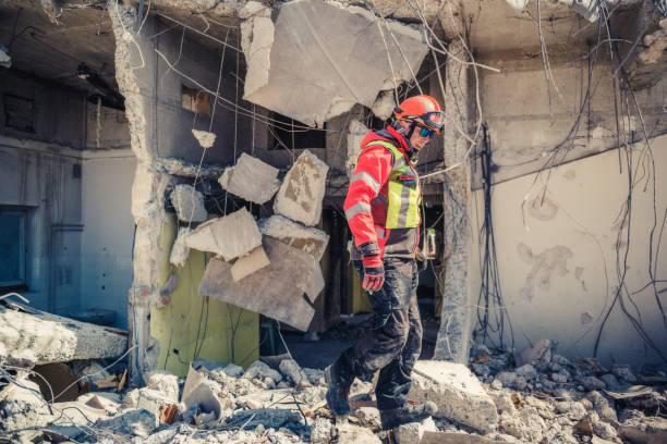 istock rescue forces search through a destroyed building 1469349731
