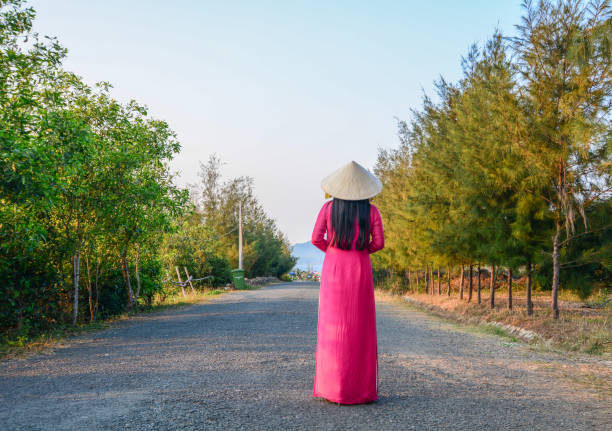 istock An Asian woman walking on road 1469350667