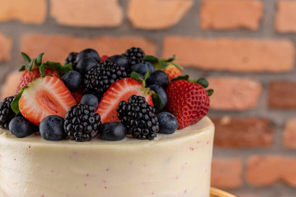 istock Dessert - Cake covered with white chocolate and red fruits 1469351442