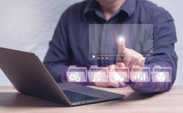 istock concept of online learning on-demand course. Man learning various fields of knowledge through online lessons, music, agriculture, industry, stocks, machinery. 1469355862