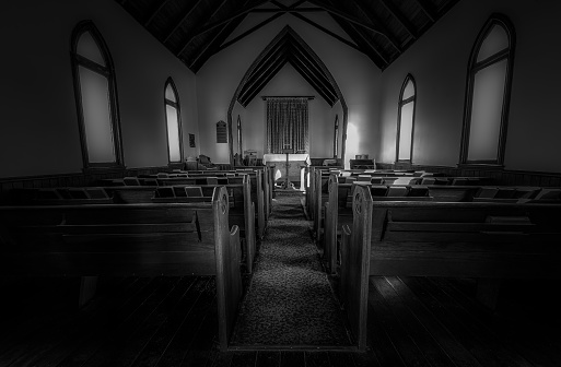 Black and white interior of an old prairie church in Canada