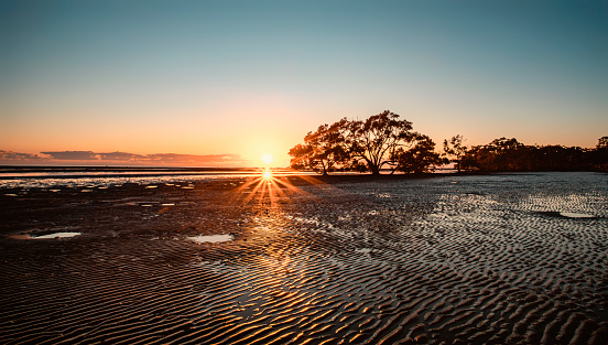 Scene of sunrise at the Nudgee Beach in Brisbane