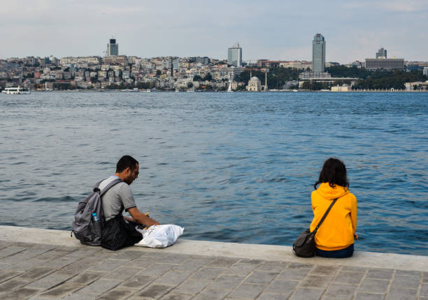 Istanbul, Turkey - Sep 29, 2018. People relaxing on promenade of Bosphorus Strait. Bosphorus is an internationally significant waterway located in northwestern Turkey.
