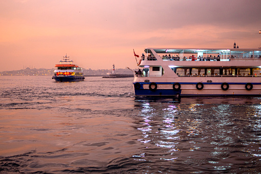 Istanbul, Turkey : January 07, 2023: Tourist boat on the Bosphorus of the Istanbul, Turkey