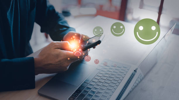 istock increasing customer satisfaction businessman using mobile phone give rating customer review by increase happy face emotional and reduce sadly face emotional. 1469372288