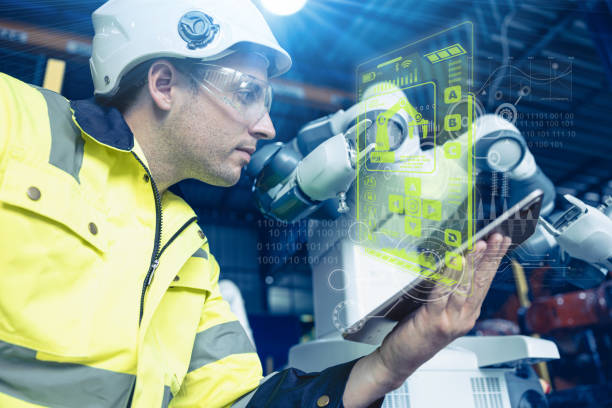 istock engineer male control operate advanced technology robotic in automation factory industry concept visual hologram effect 1469374621