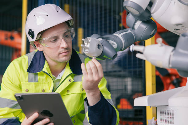 istock professional engineer male caucasian working with automated robotic arm for modern industry factory technology 1469374625