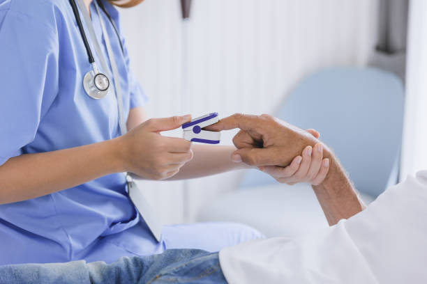 istock closeup nurse doctor using fingertip pause oximeter measures blood oxygen saturation level with patient 1469374685