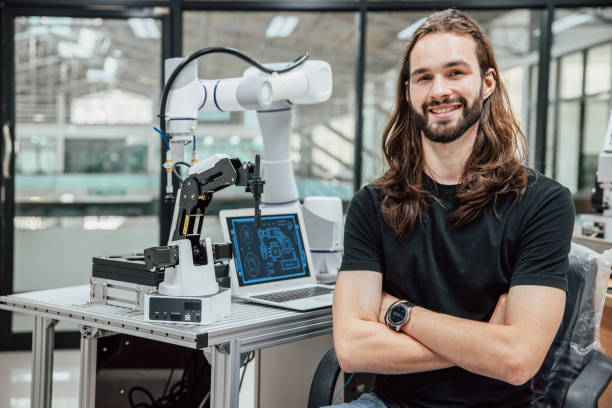 portrait robot engineer programmer. robotic lab research and development team young teen people.