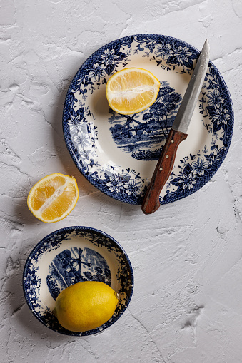 Istanbul, Turkey-January 6, 2023: Lemons on dark blue ceramic plates with floral and nature pattern. Shot with Canon EOS R5.