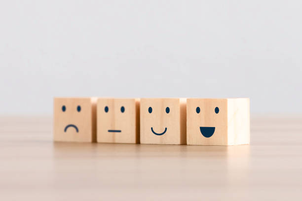 istock the happy face smile face icon on a wooden cube for Customer service evaluation customer satisfaction level and satisfaction survey concepts. 1469387325