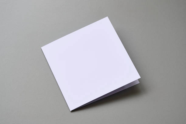 istock Laying closed square greeting card template on cool grey background 1469394202