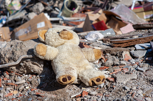 A teddy bear left in the rubble of the earthquake
