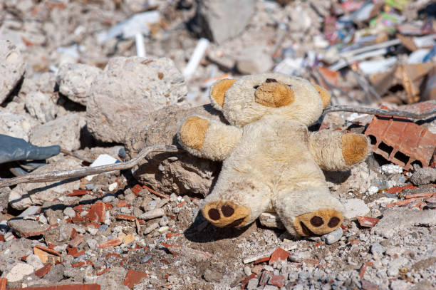 istock A child's teddy bear in earthquake debris 1469394903