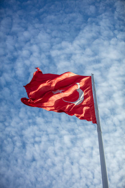 istock Turkish flag with cloudy blue sky as a background 1469397954