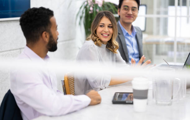 istock Diverse Corporate Employees Sitting At Conference Room Table 1469399144