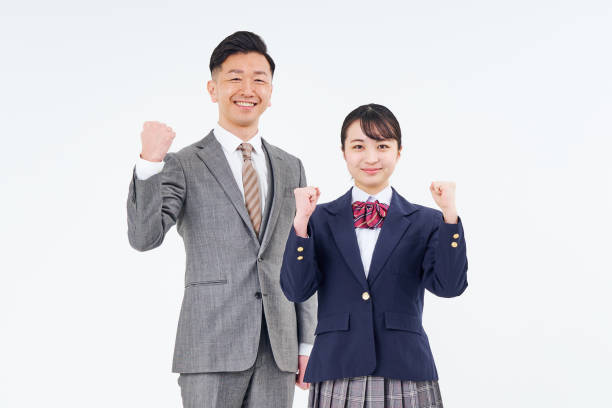 istock A man and a high school girl in a suit doing a guts pose 1469402204