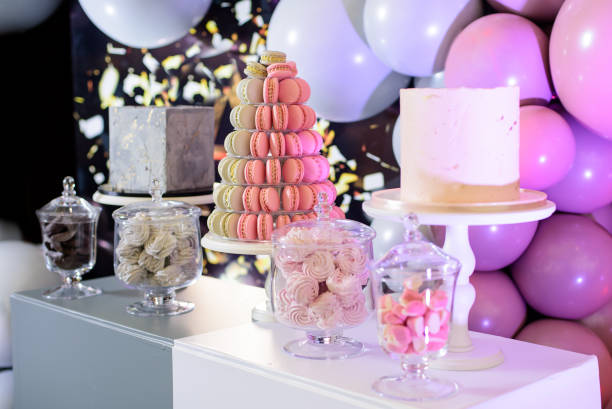istock Pyramid of macaroons and birthday cakes on candy bar 1469405173