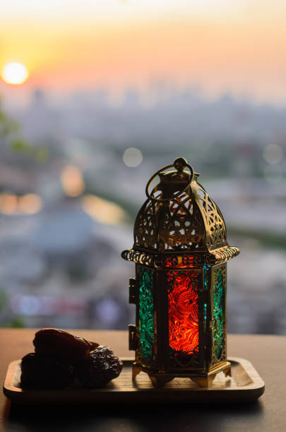 istock Lantern and dates fruit with dusk sky and city background 1469407164